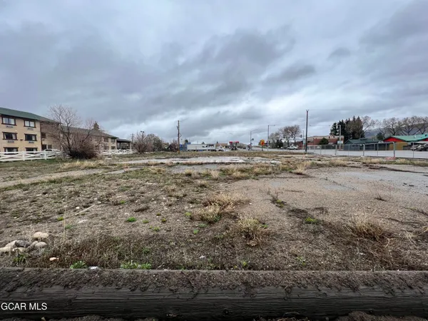 a view of a city street with a building