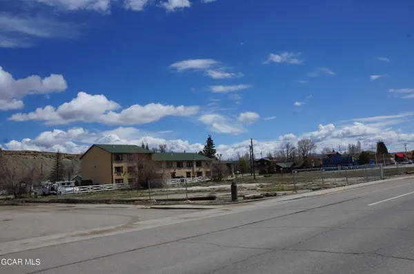 a view of a house with a street