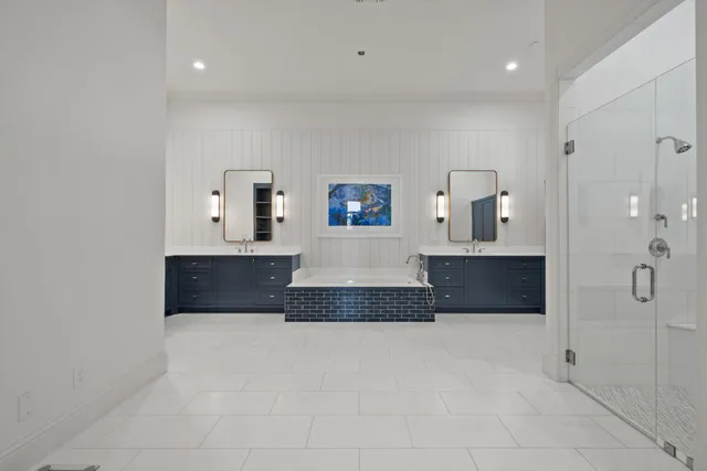 a spacious bathroom with a tub and mirror