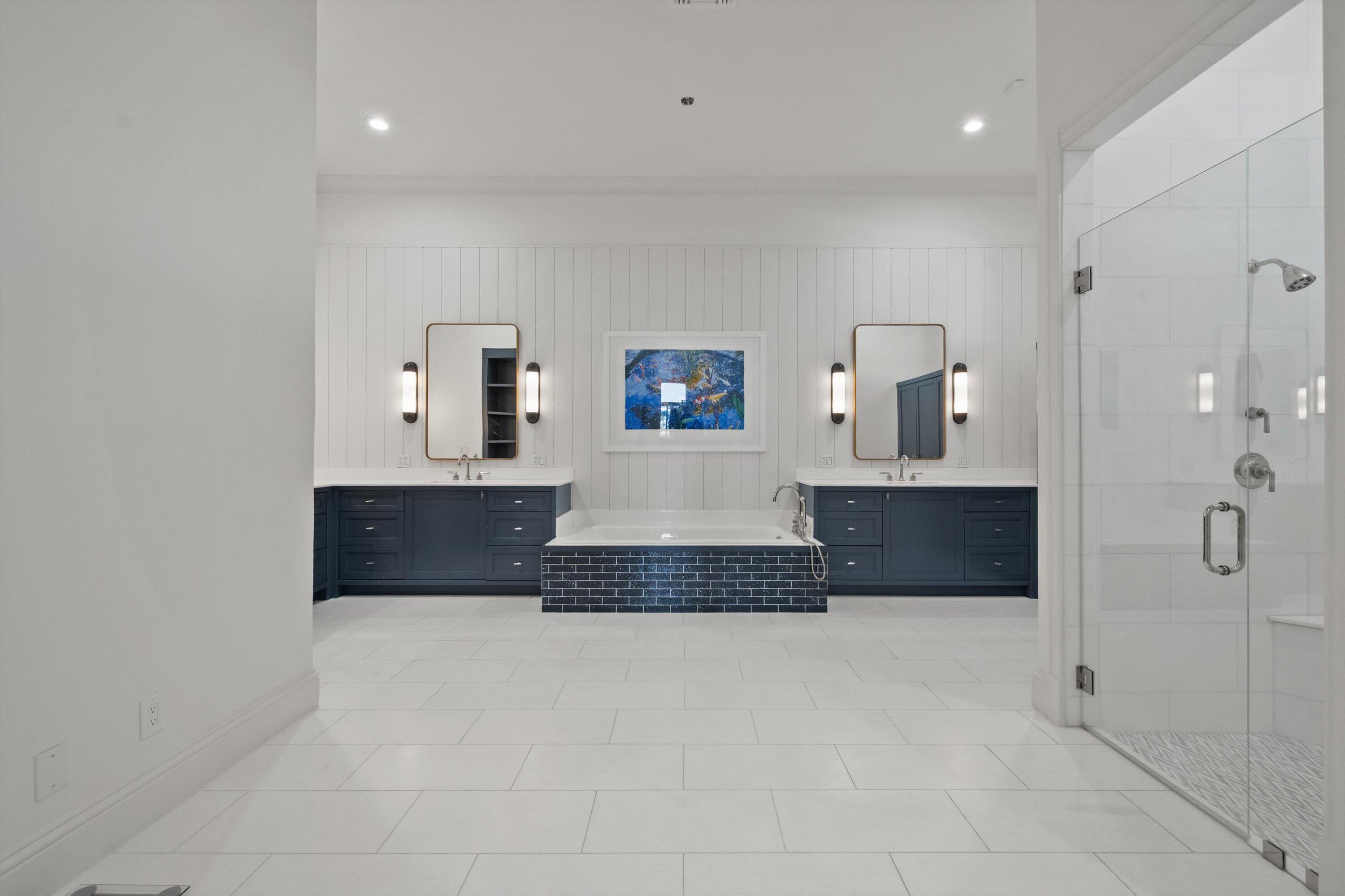 2270 Wilsee Road Palm Beach Gardens, FL 33410 - Photo 17 of 49 a spacious bathroom with a tub and mirror