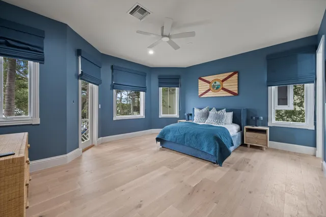 a spacious bedroom with a large bed and a window