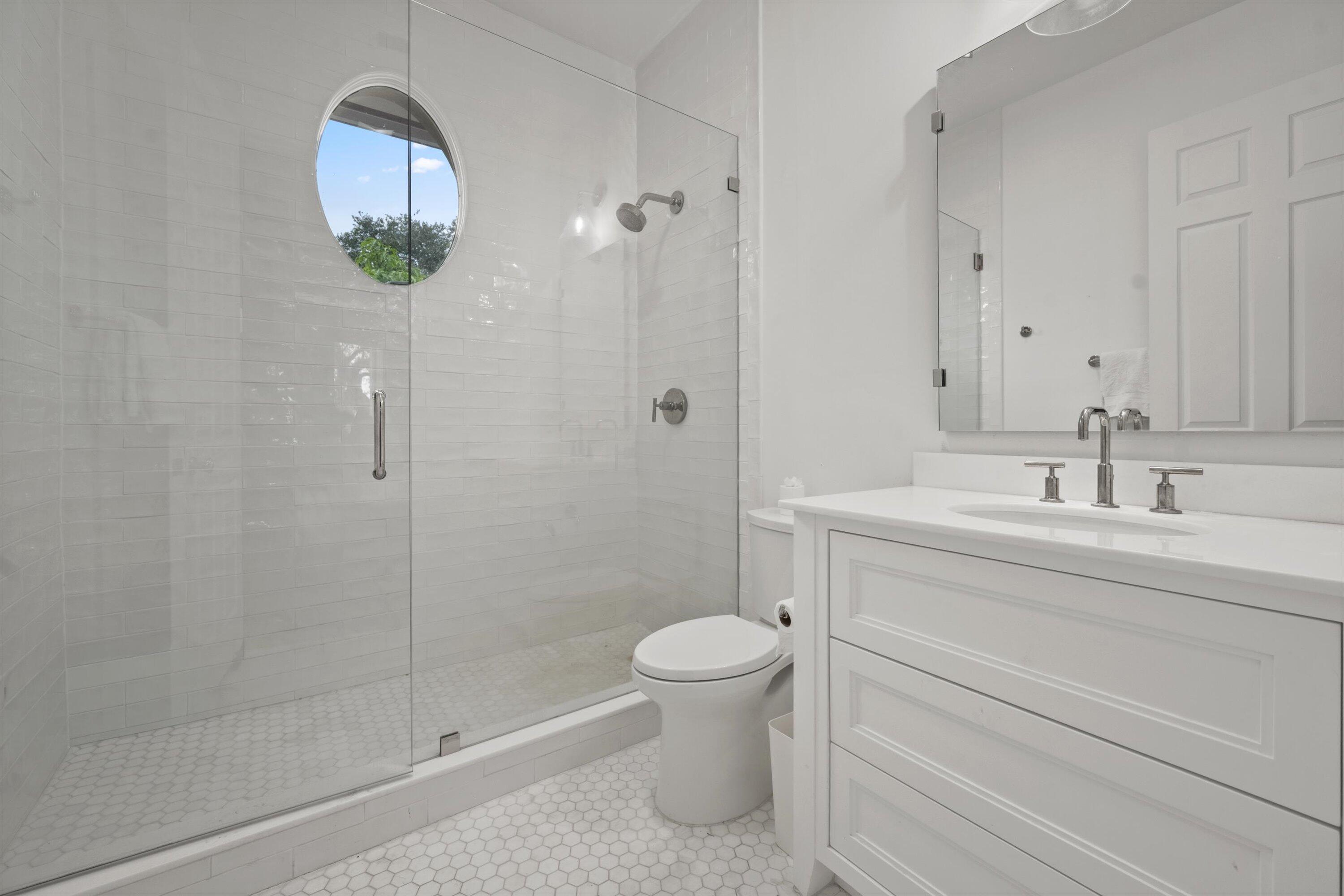 2270 Wilsee Road Palm Beach Gardens, FL 33410 - Photo 32 of 49 a bathroom with a sink a toilet and shower