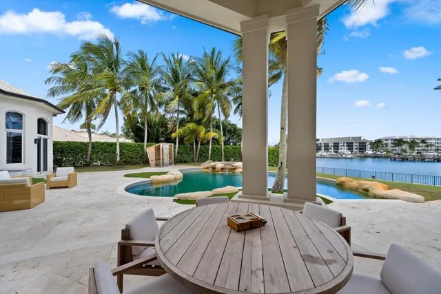 a view of a swimming pool with a lounge chairs