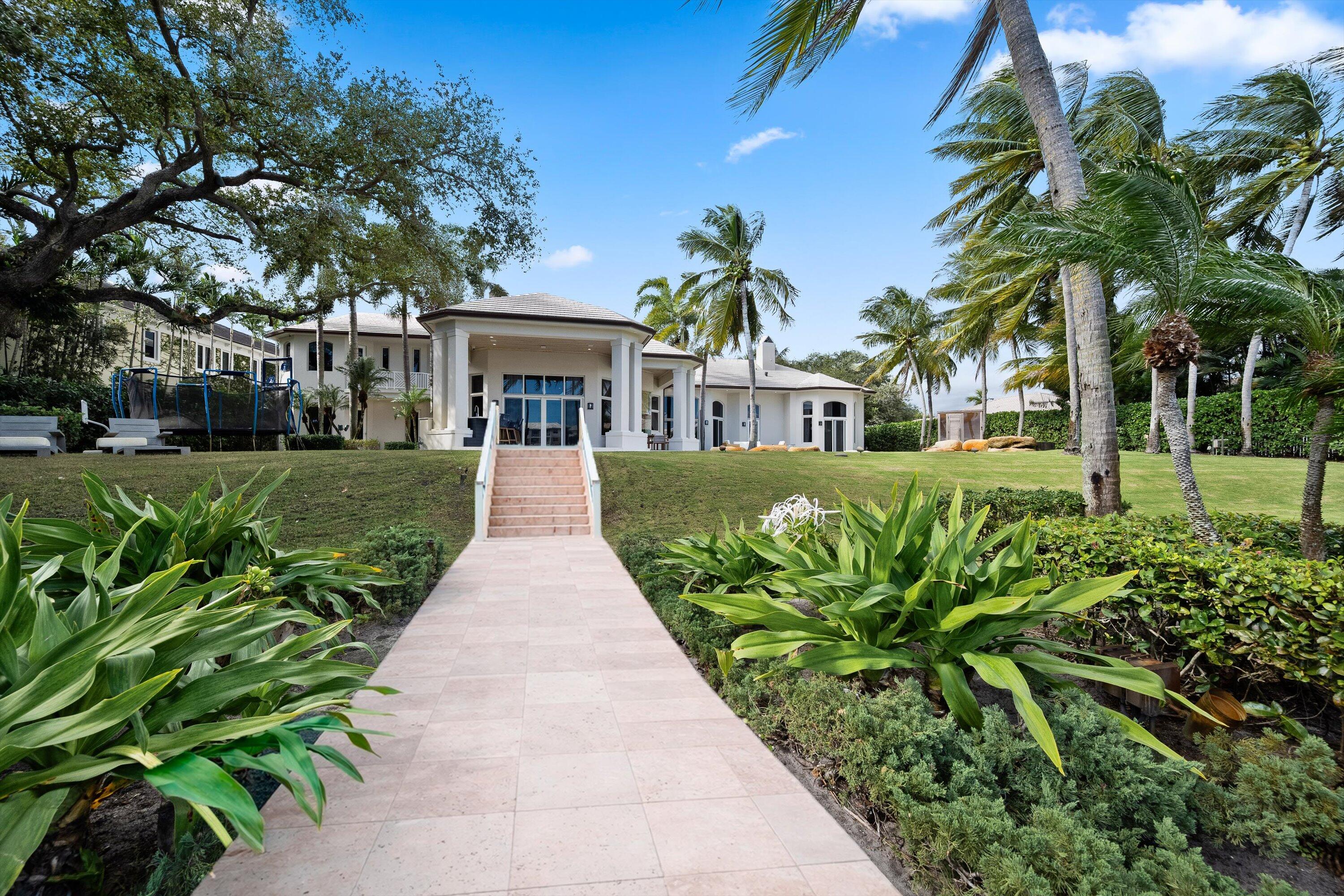 2270 Wilsee Road Palm Beach Gardens, FL 33410 - Photo 43 of 49 a view of a house with a yard