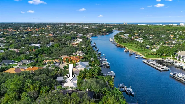 an aerial view of residential building and lake