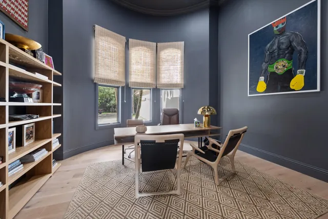 a workspace with furniture and window