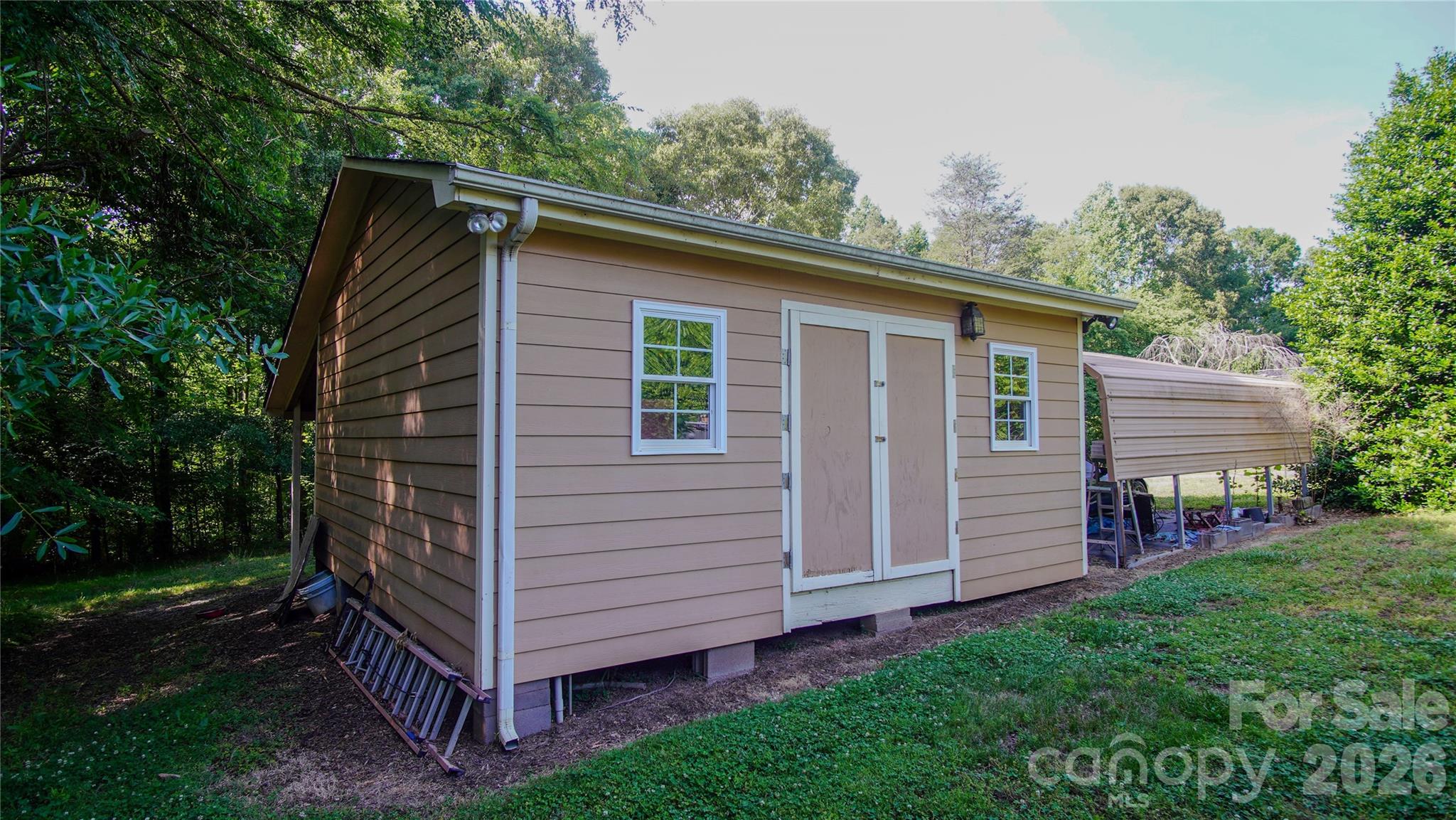 204 Old Stage Coach Road Lawndale, NC 28090 - Photo 26 of 30 a view of a house with a backyard