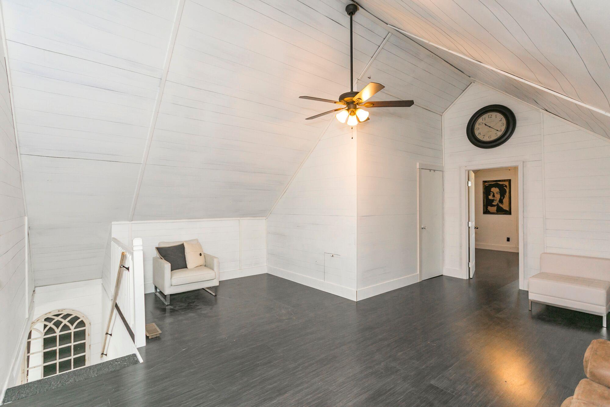 7690 Joe Rowlin Road Christiana, TN 37037 - Photo 12 of 18 a view of a hardwood floor and a ceiling fan in a room