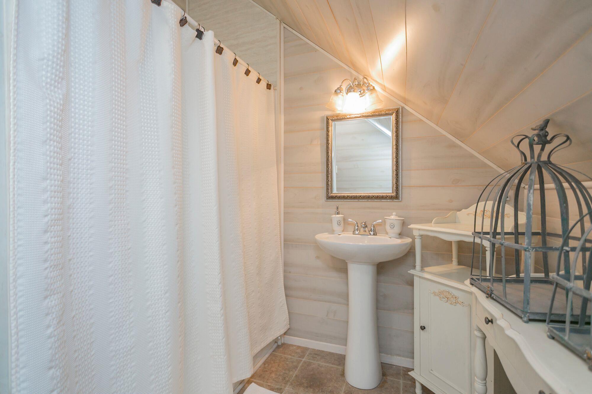 7690 Joe Rowlin Road Christiana, TN 37037 - Photo 15 of 18 a bathroom with a sink and a mirror
