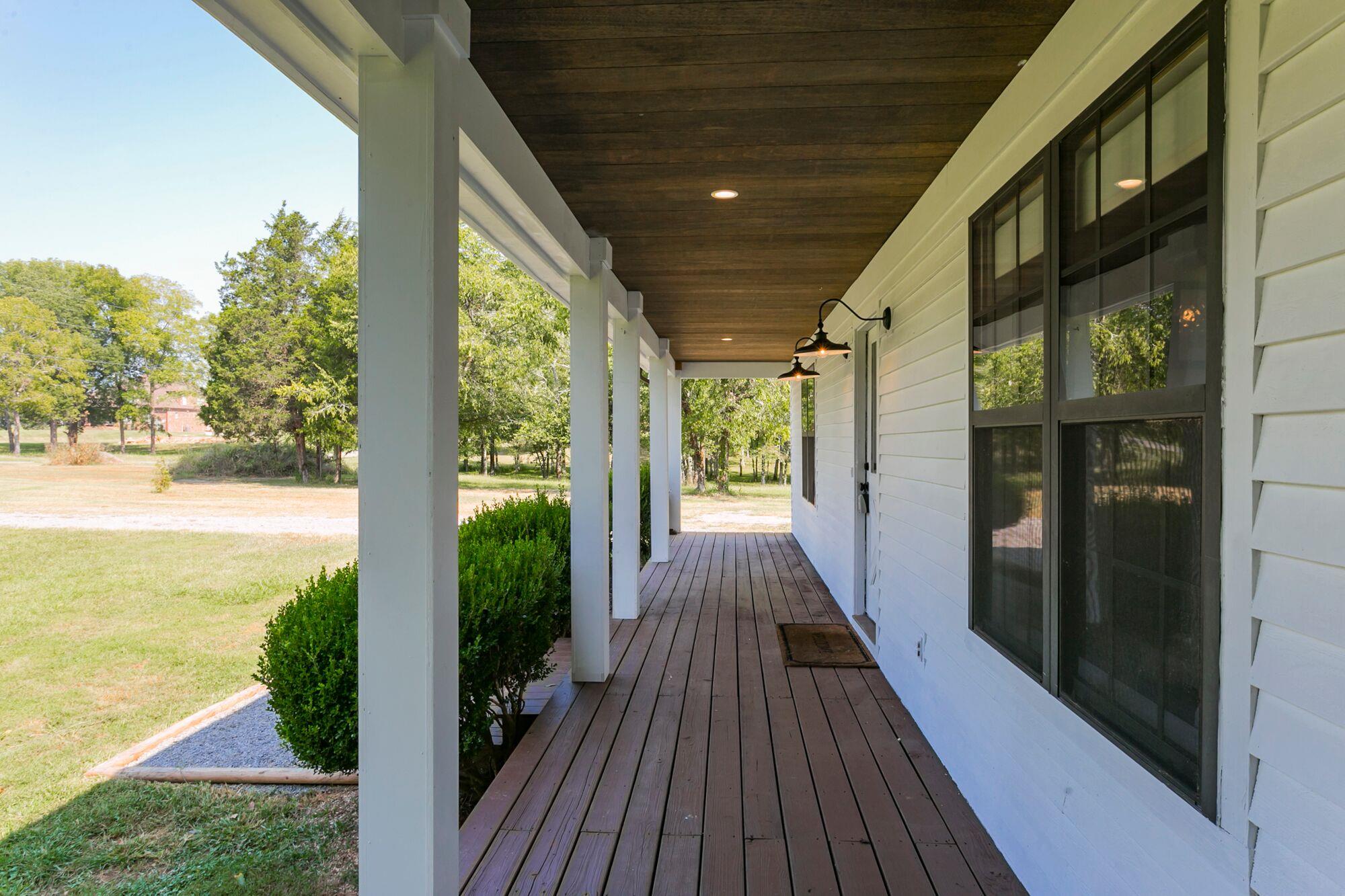 7690 Joe Rowlin Road Christiana, TN 37037 - Photo 18 of 18 a view of a balcony with wooden floor
