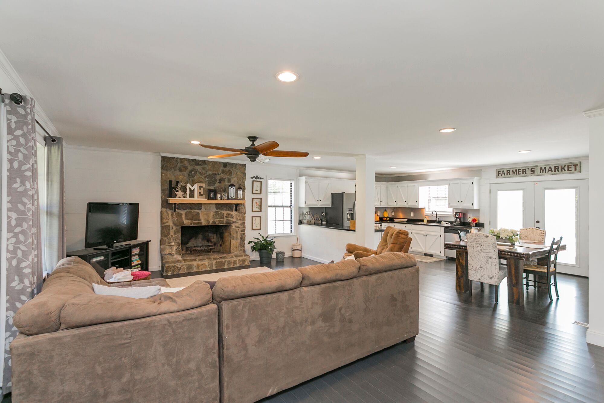 7690 Joe Rowlin Road Christiana, TN 37037 - Photo 3 of 18 a living room with fireplace furniture and a flat screen tv
