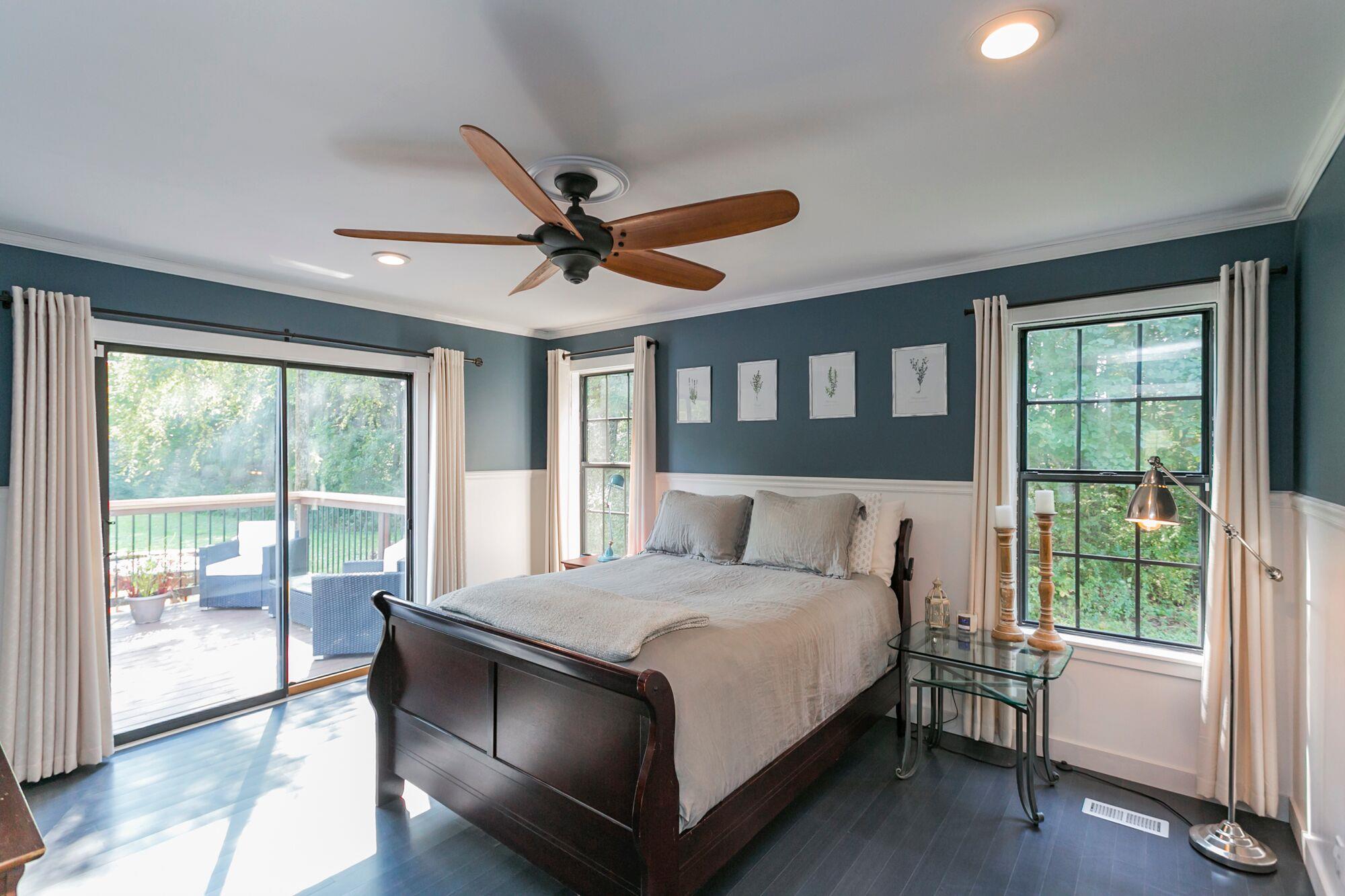 7690 Joe Rowlin Road Christiana, TN 37037 - Photo 5 of 18 a large bedroom with a large bed and a large window
