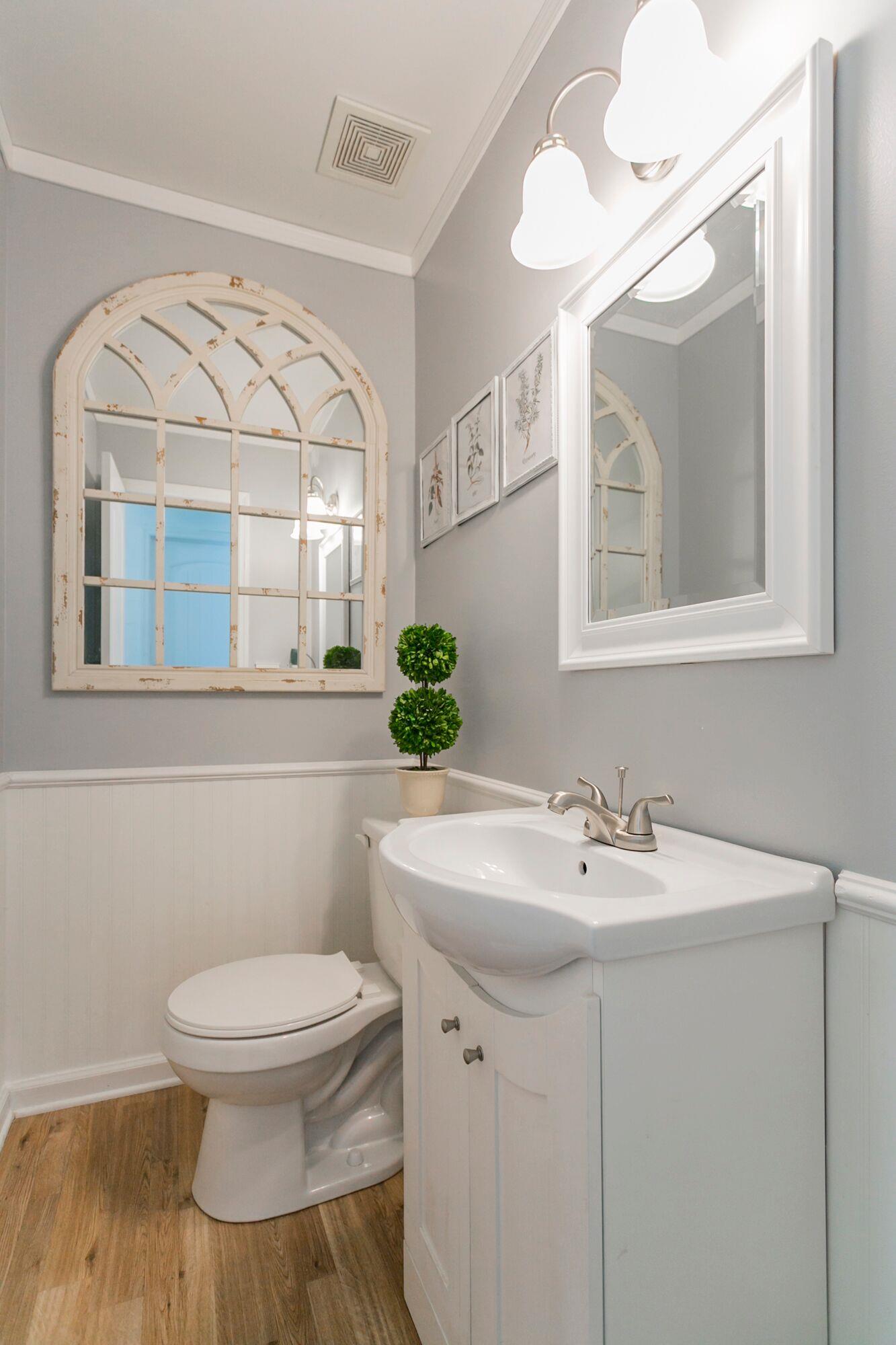 7690 Joe Rowlin Road Christiana, TN 37037 - Photo 9 of 18 a bathroom with a toilet a sink and a mirror