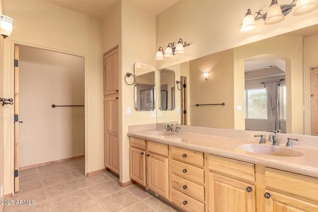 a spacious bathroom with a double vanity sink mirror double and bathtub