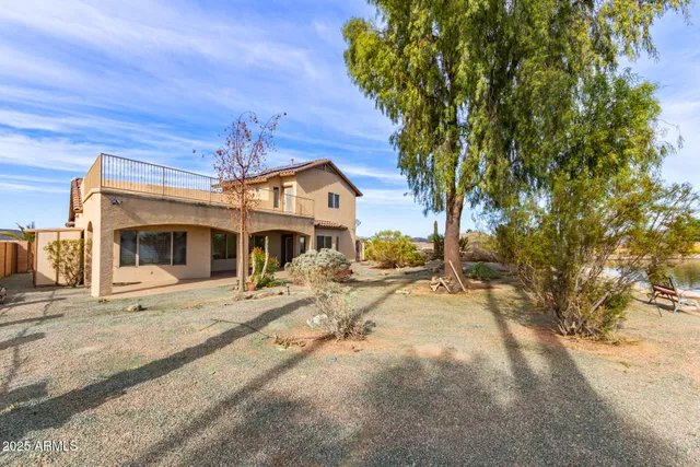 a view of a fire pit with large trees