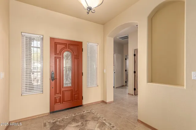 a view of a kitchen with refrigerator and cabinets