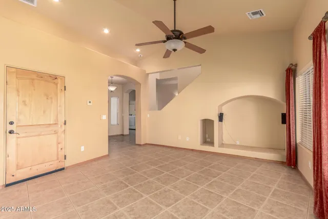 a view of a livingroom with a staircase