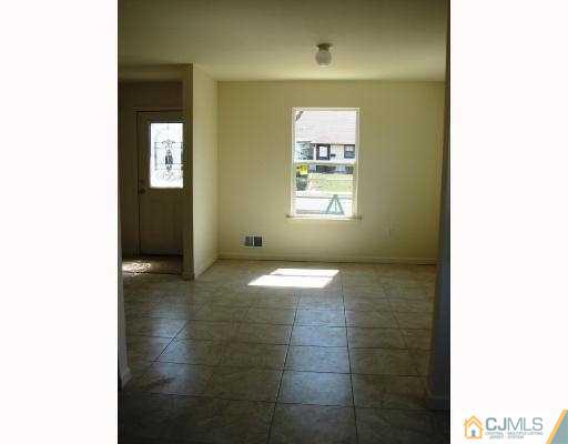 8 Markham Road Edison, NJ 08817 - Photo 3 of 7 a view of an empty room with a window
