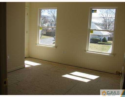 8 Markham Road Edison, NJ 08817 - Photo 5 of 7 a view of an empty room with a window