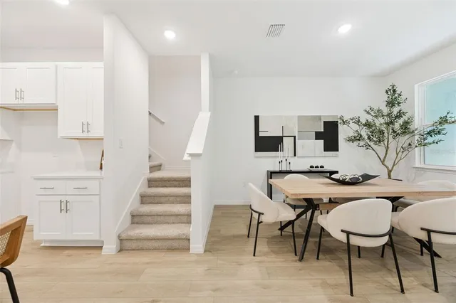 a living room with furniture and white walls