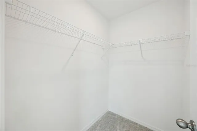 a view of a balcony with floor to ceiling windows with wooden floor