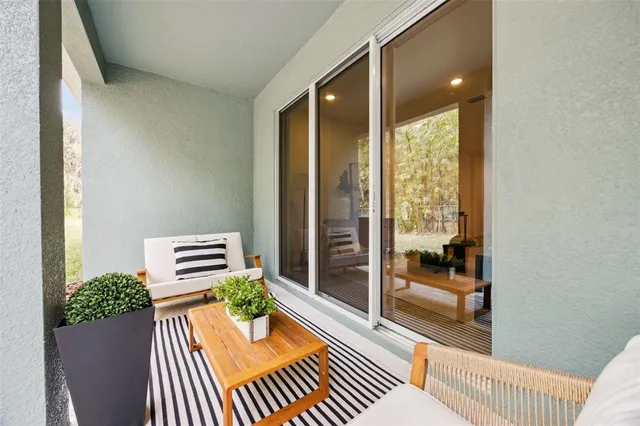 an aerial view of a residential apartment building with a yard