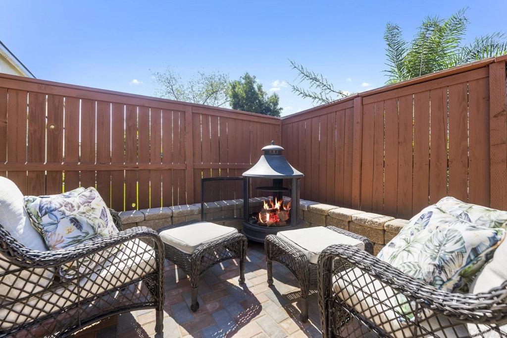 1113 Teal Way Oceanside, CA 92057 - Photo 35 of 49 a view of a patio with a table and chairs