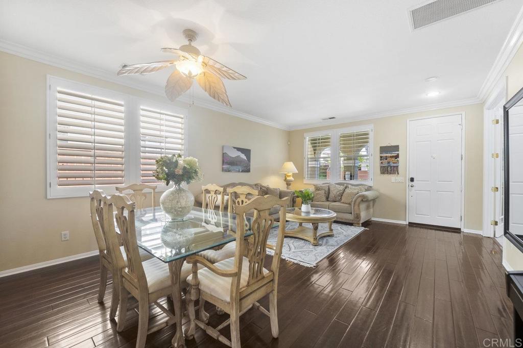 1113 Teal Way Oceanside, CA 92057 - Photo 7 of 49 a view of a dining room with furniture and wooden floor