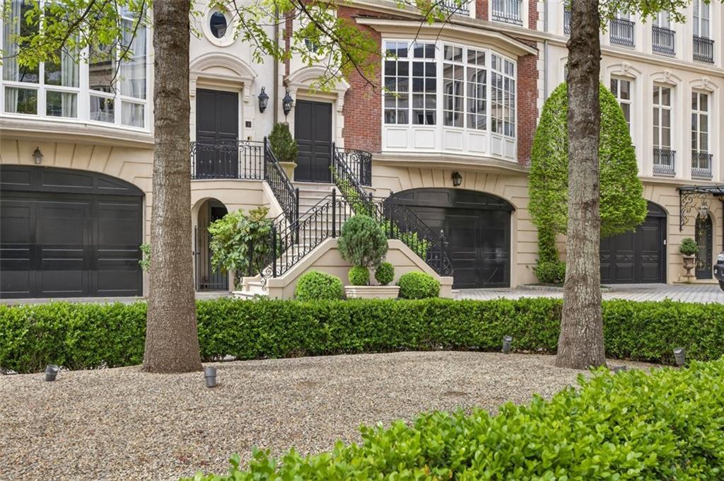 2288 Peachtree Road Northwest, Unit 4 Atlanta, GA 30309 - Photo 46 of 50 a front view of a building with a garden and plants