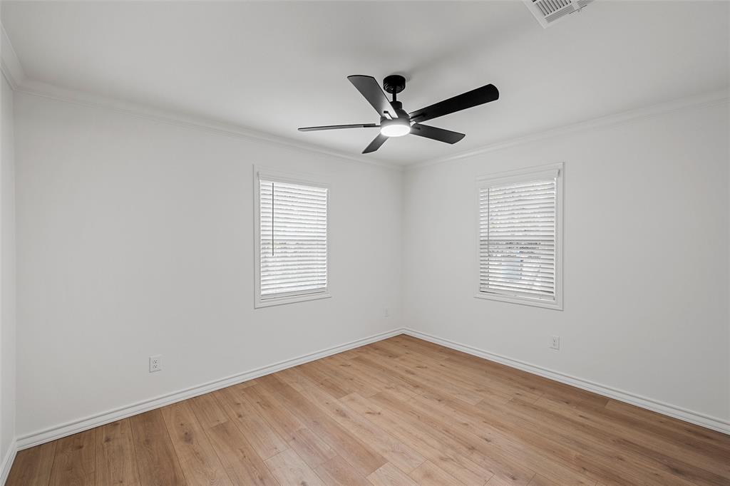 611 North Rita Street Lacy-Lakeview, TX 76705 - Photo 11 of 17 Unfurnished room featuring crown molding and light wood-style floors