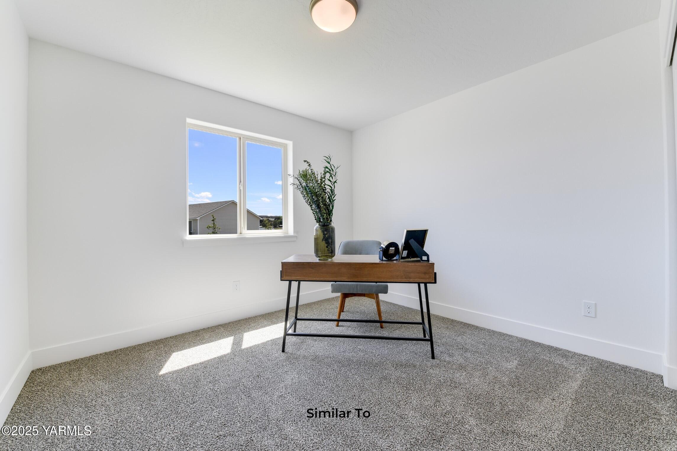 506 Grapevine Street, Unit PHASE 3 LOT 11) SPEC Grandview, WA 98930 - Photo 15 of 22 a view of a workspace with furniture