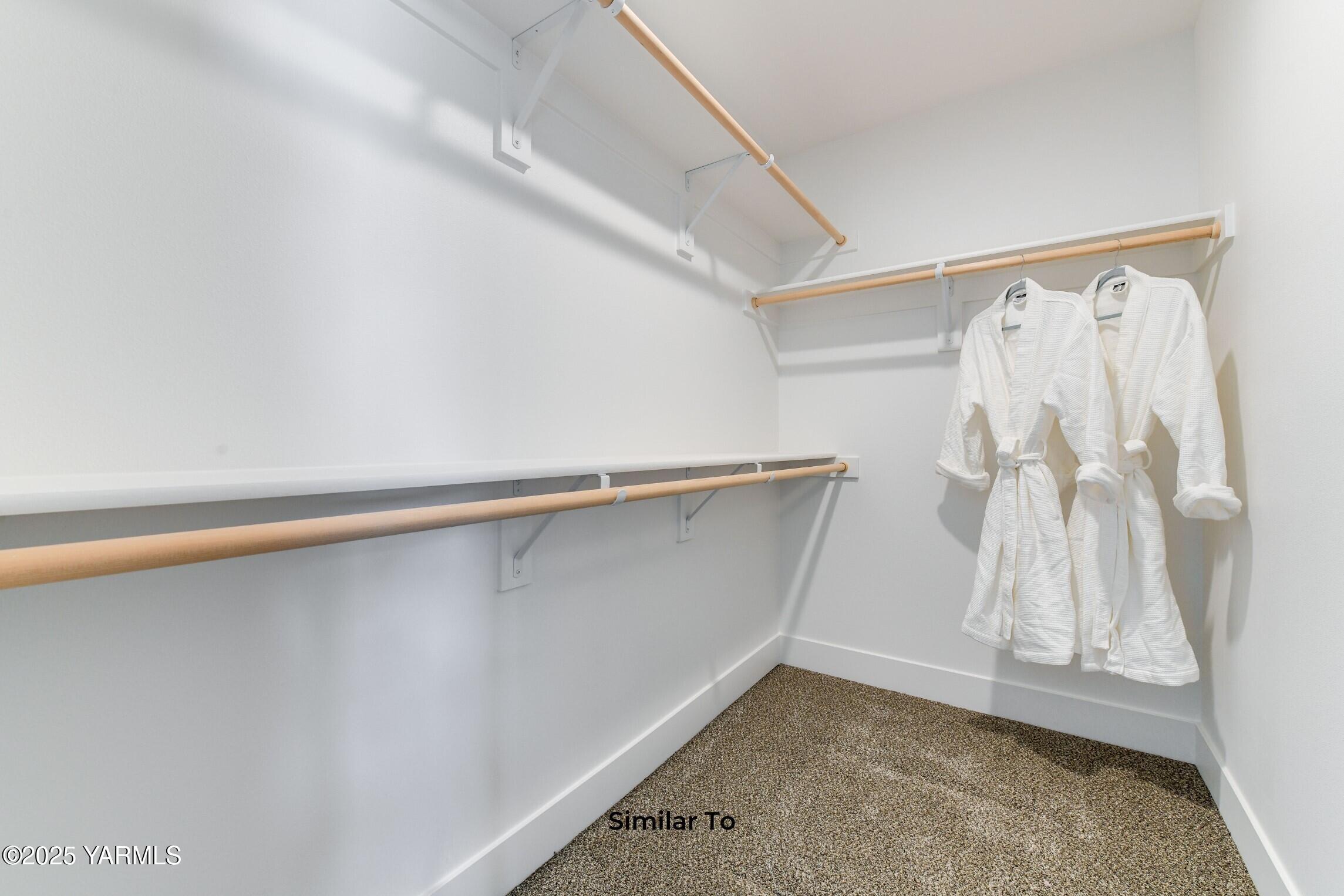 506 Grapevine Street, Unit PHASE 3 LOT 11) SPEC Grandview, WA 98930 - Photo 20 of 22 a view of walk in closet with empty racks