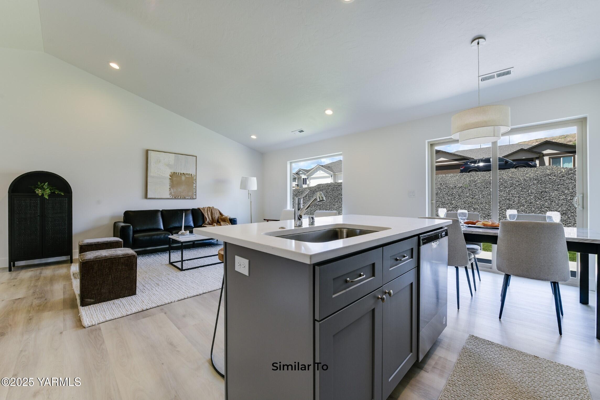 506 Grapevine Street, Unit PHASE 3 LOT 11) SPEC Grandview, WA 98930 - Photo 10 of 22 a kitchen with sink and cabinets