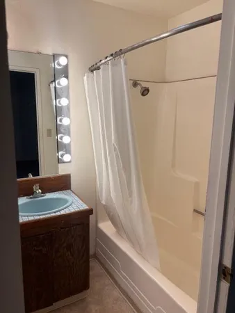 a bathroom with a sink and a mirror