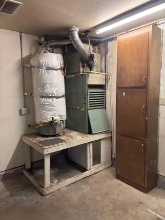 a kitchen with stainless steel appliances granite countertop a refrigerator and a stove