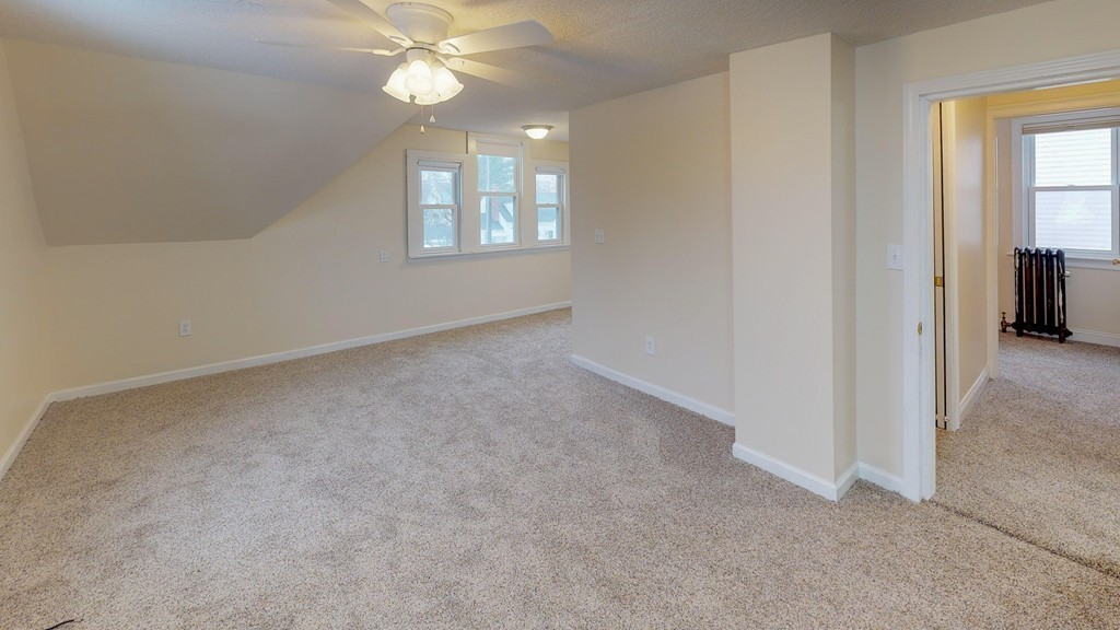 64 Coleman Street Springfield, MA 01109 - Photo 18 of 27 an empty room with windows and fan