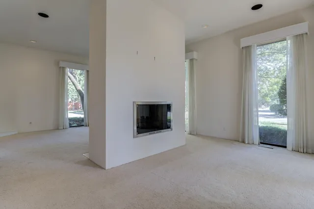 a view of kitchen with furniture and refrigerator