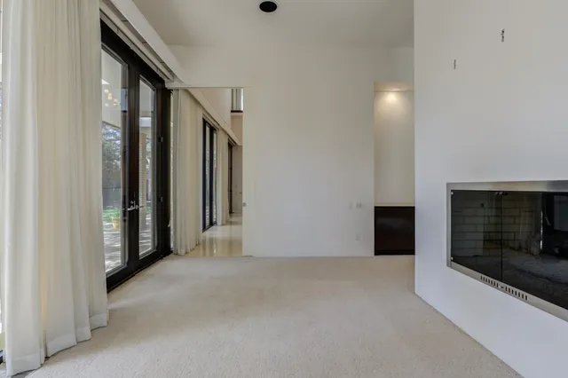 a kitchen with stainless steel appliances granite countertop a refrigerator and a stove