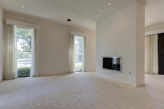 a kitchen with a sink and a wooden floor