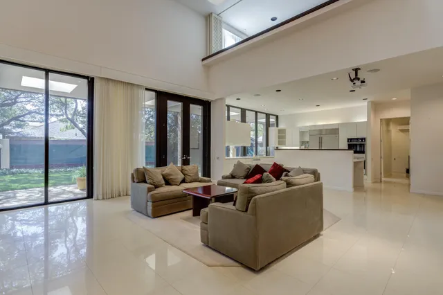 a spacious bedroom with a bed and a window