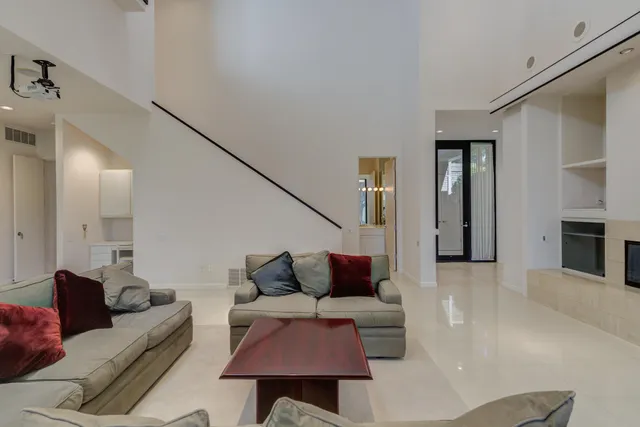 a bathroom with a sink vanity mirror and toilet