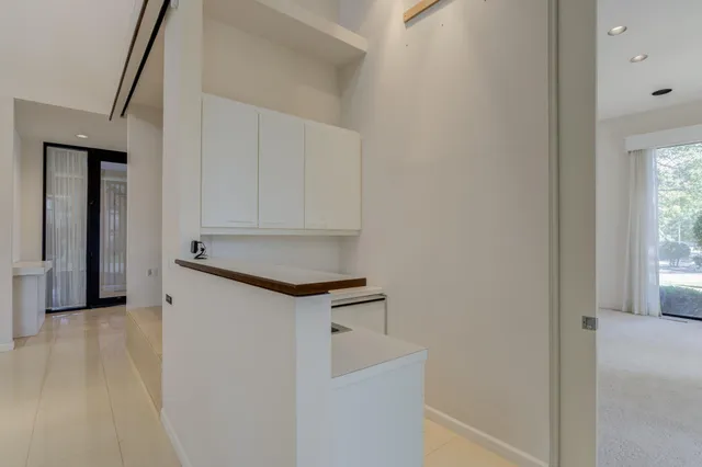 a bathroom with a double vanity sink a mirror and a shower