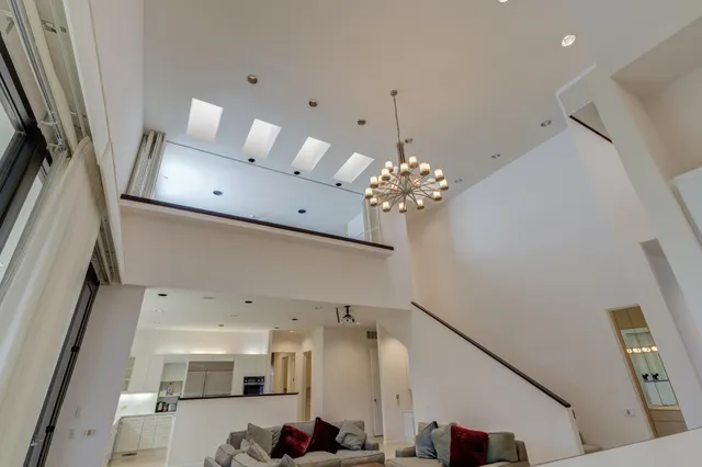a bathroom with a shower and a sink