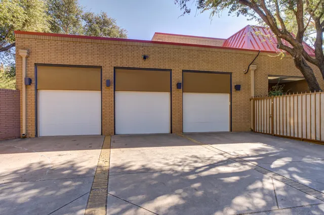 an empty room with closet and windows