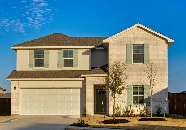 a front view of a house with yard