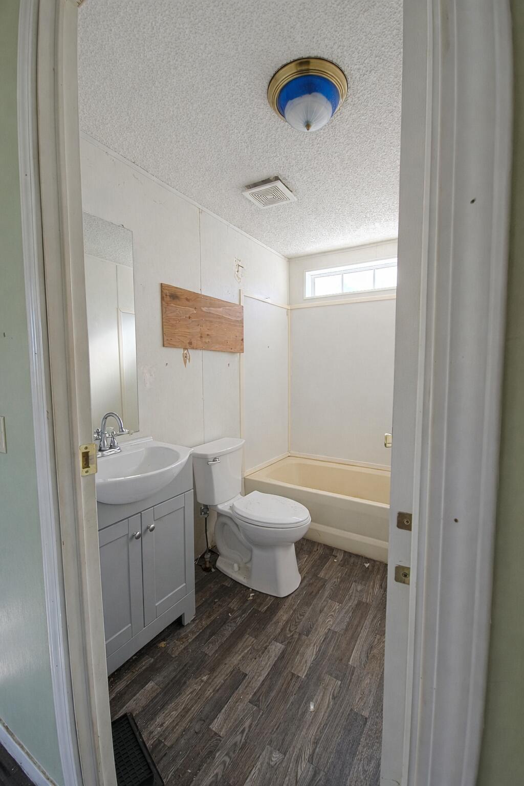 126 Butte Falls Highway Eagle Point, OR 97524 - Photo 4 of 10 a bathroom with a sink a toilet and shower