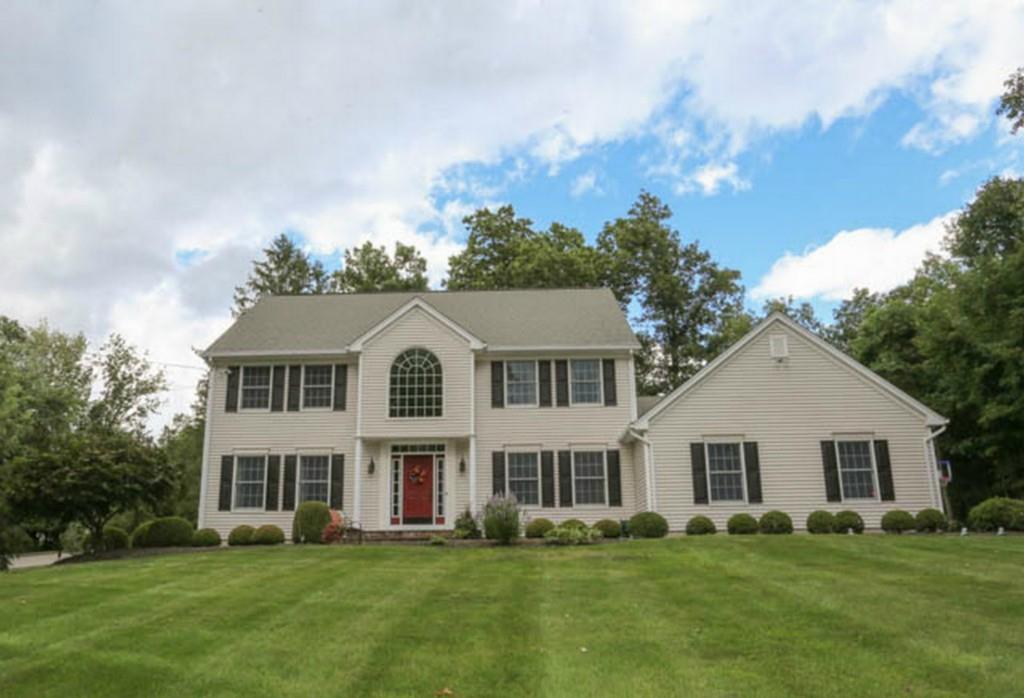 6 Cross Road Brookfield, CT 06804 - Photo 1 of 1 a front view of a house with a garden and trees