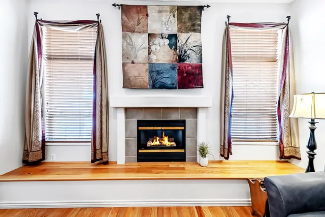 a view of a room with furniture and wooden floor