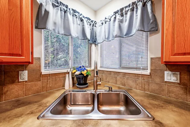 a bathroom with a sink a mirror and a shower