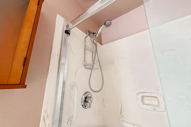 a living room with furniture a bookshelf and a book shelf